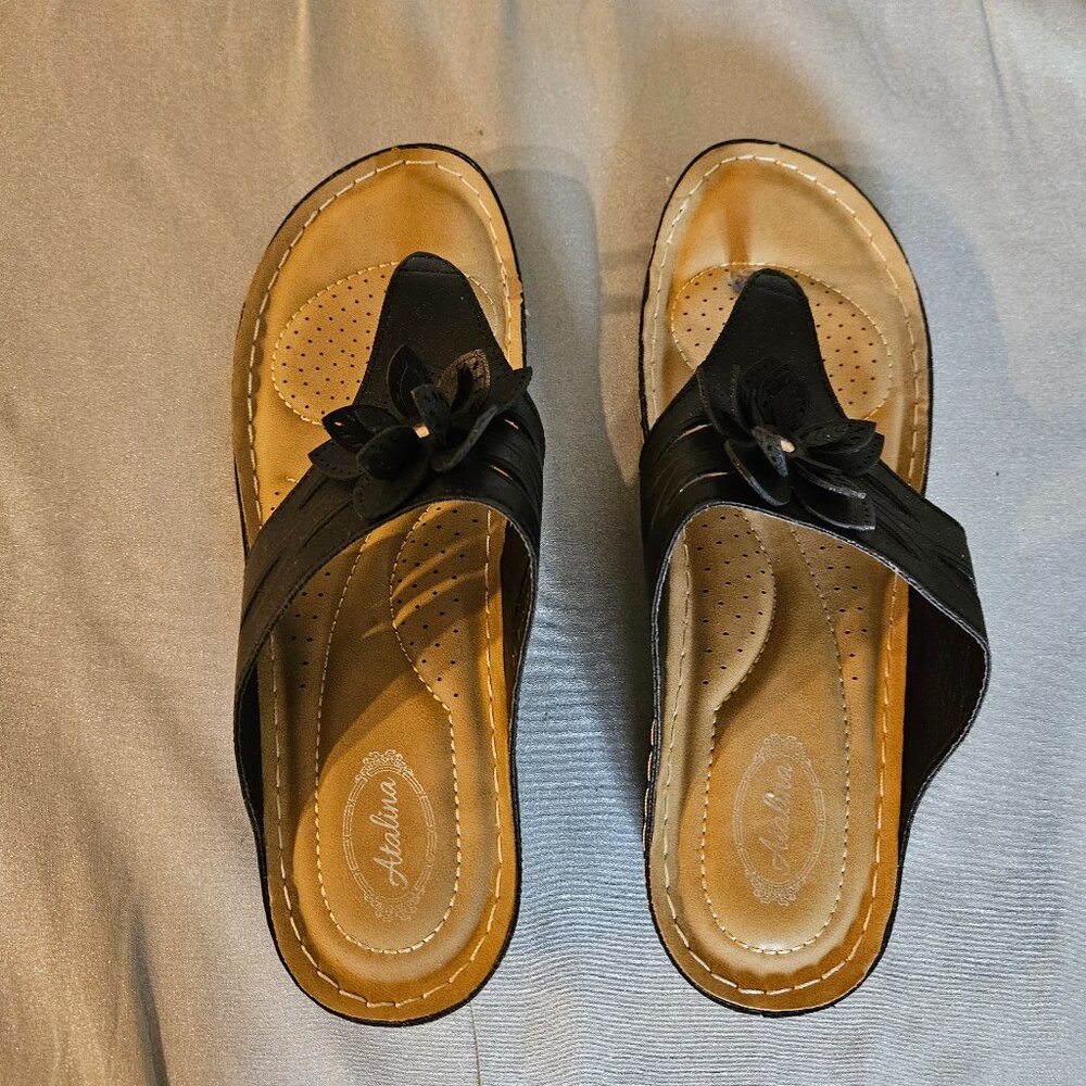 Atalina black wedge slip-on sandals.